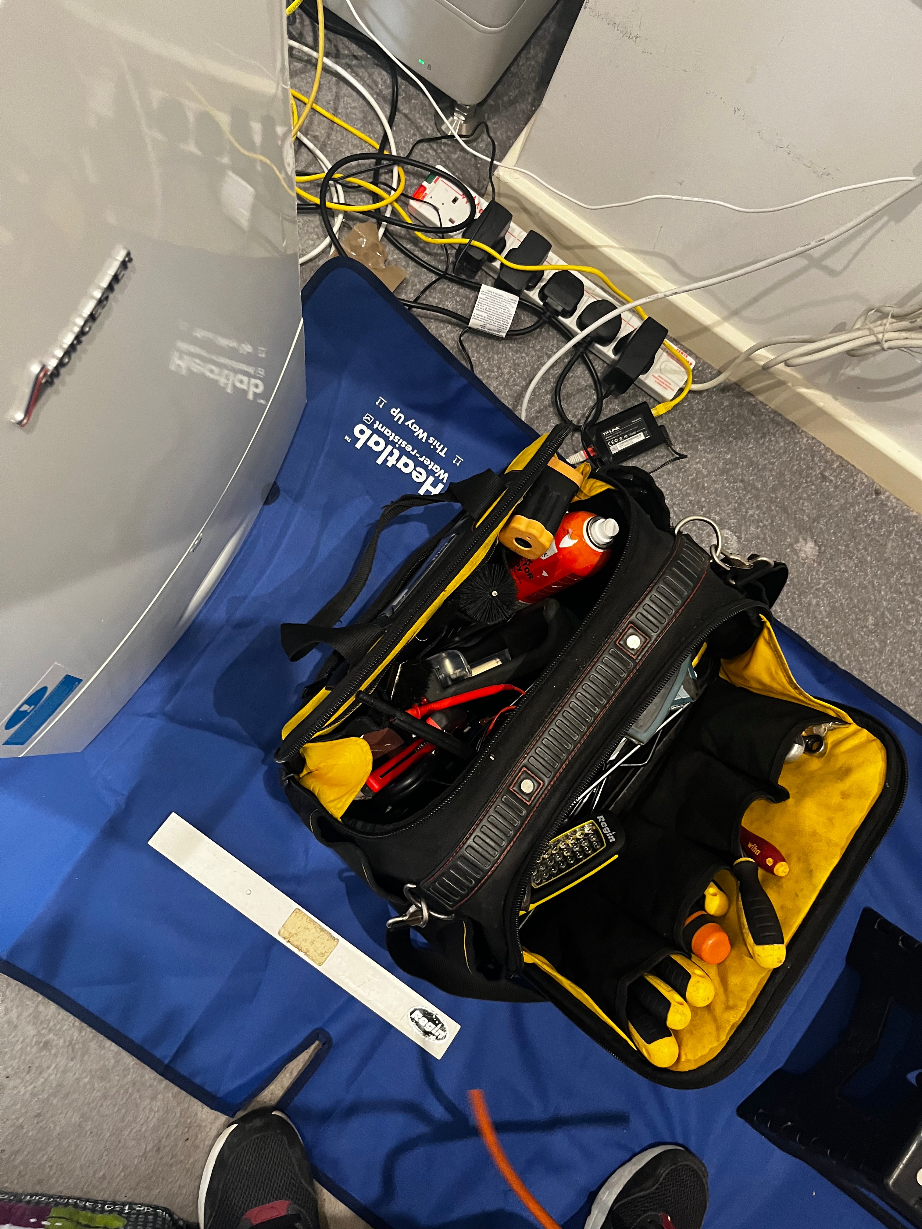 The waterproof work mat that fits around radiator pipes.