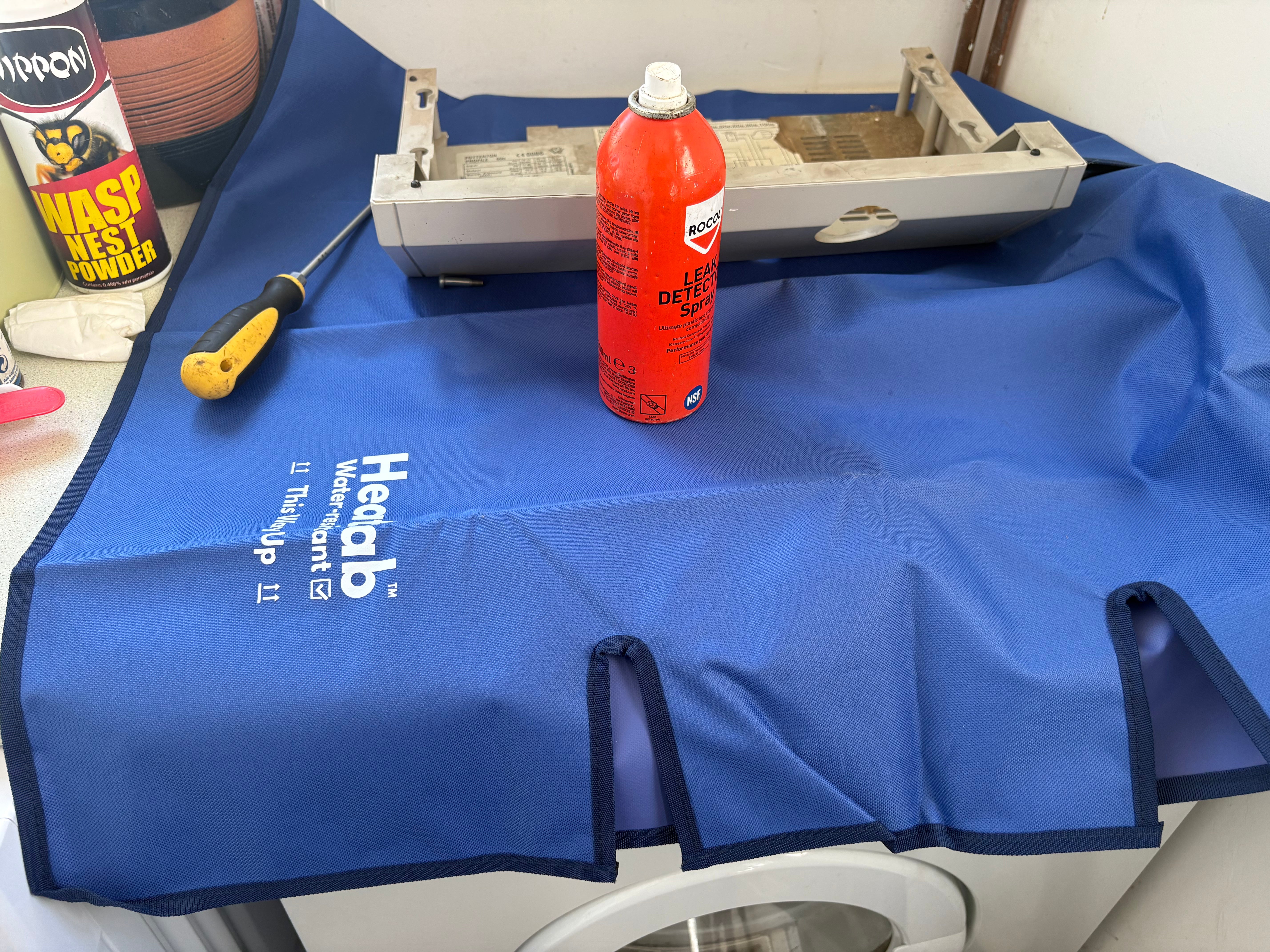The waterproof work mat that fits around radiator pipes.