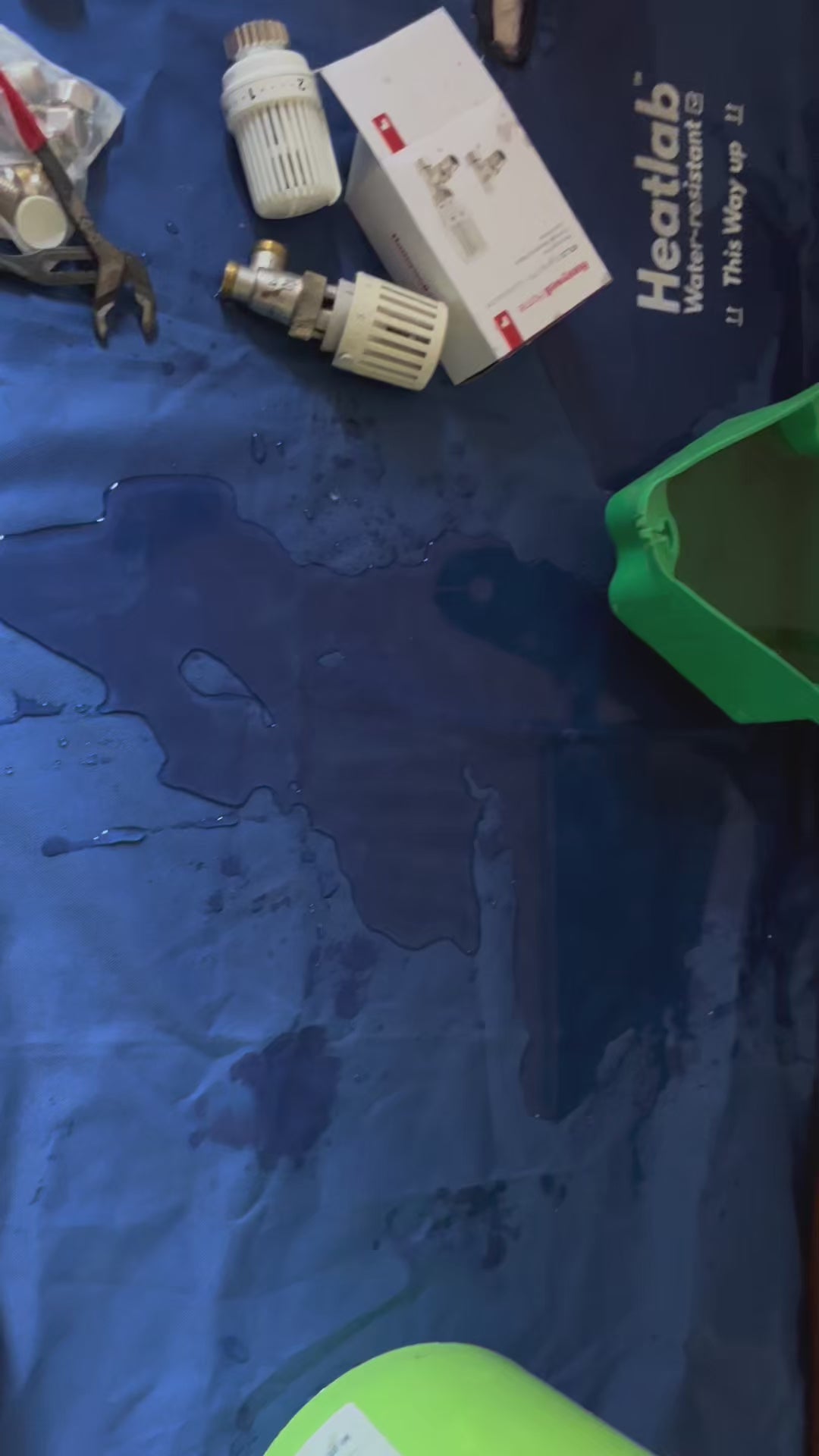 Plumbers Dust Sheet - The waterproof work mat that fits around radiator pipes.